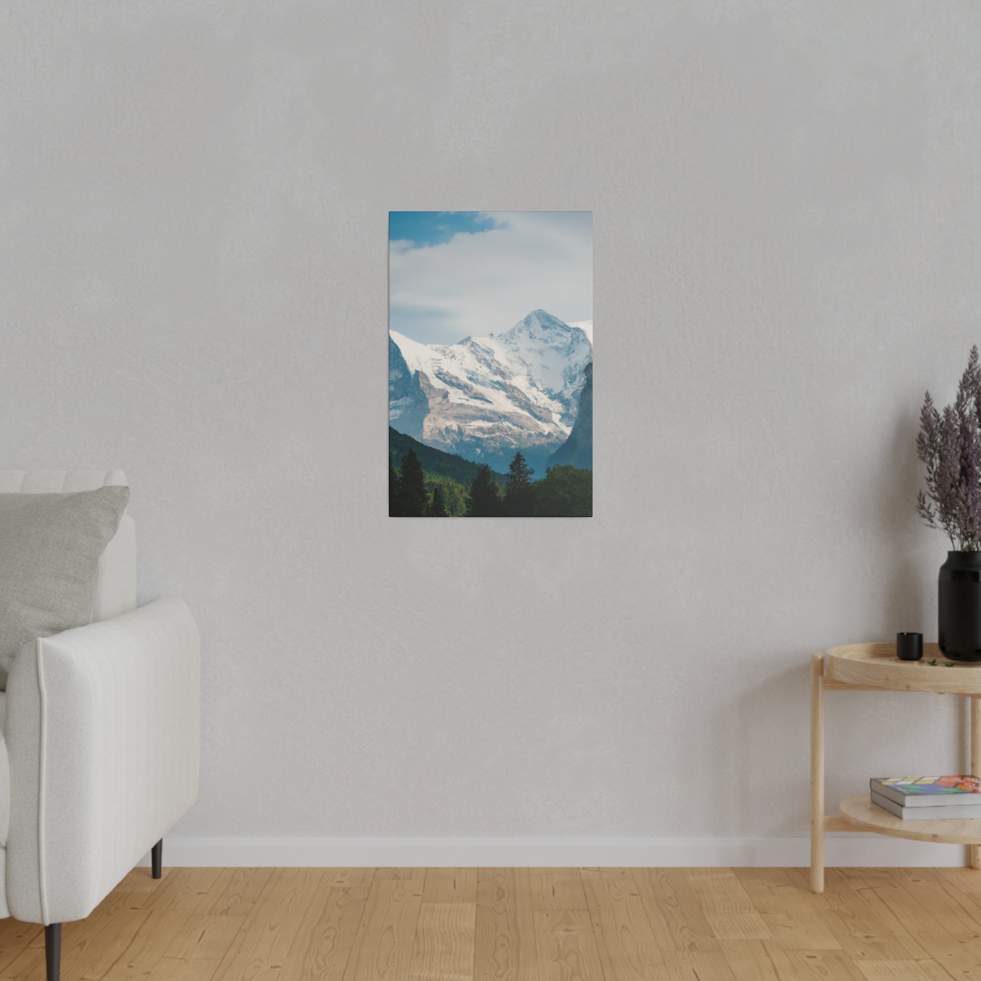Quality canvas of a snow-capped mountain and forests, complete with ethical pine frame and pre-installed back hanging.