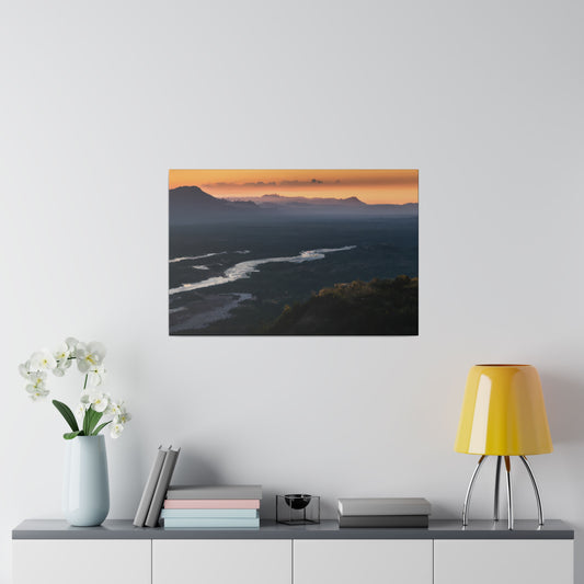 Captivating canvas print showcasing mountains under the soft hues of dusk. Comes with a matte finish, ethically-sourced radial pine frame, and back hanging for effortless placement.